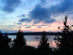 Sunset reflected on Bartlett Cove from the deck at Glacier Bay Lodge.