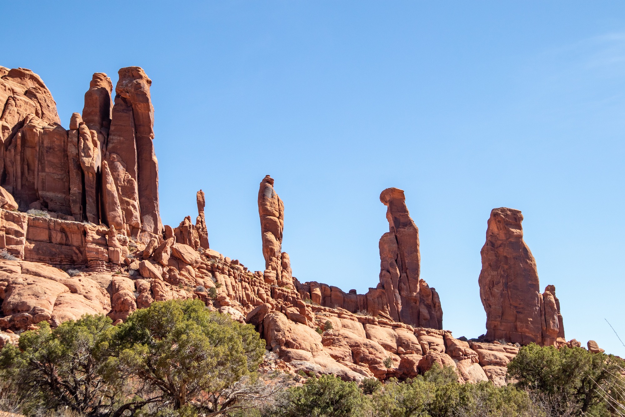 The Marching Men in the Klondike Bluffs area. Accessible via an 8-mile drive down a dirt road and a 1.5 mile hike to Tower Arch