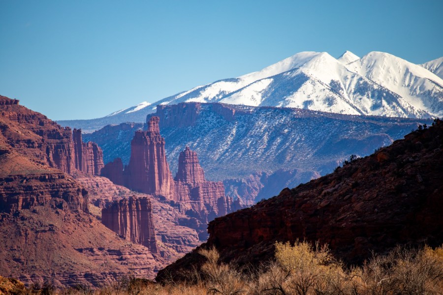 Fisher Towers and the La Sal Mountains viewed from the Utah 128 scenic byway.
