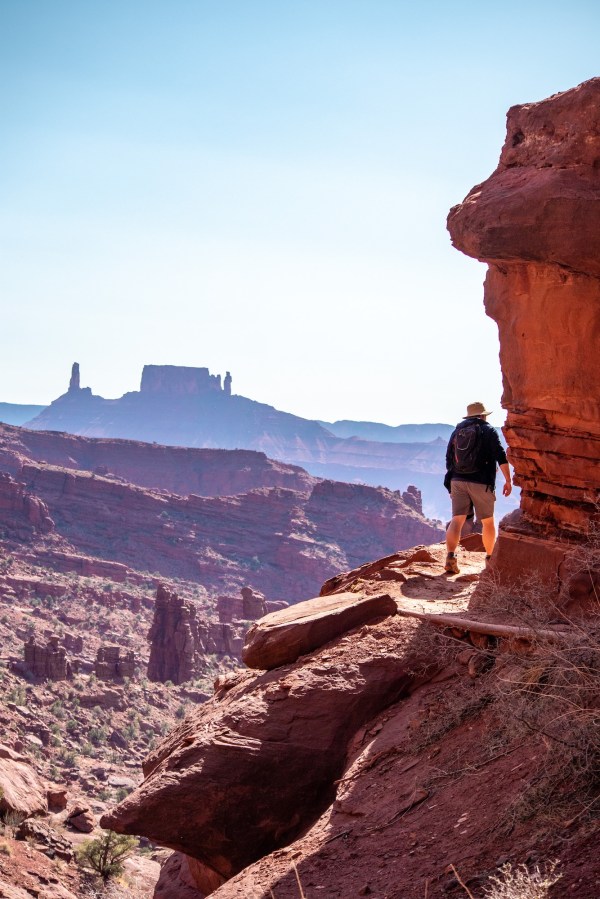 Hiking around the base of Fisher Towers, Castleton tower in the distance.